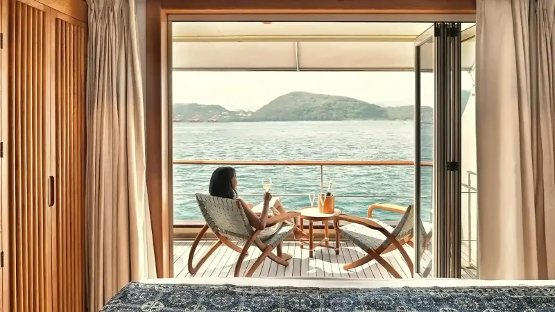 A stateroom balcony looking out over Labuan Bajo from on board