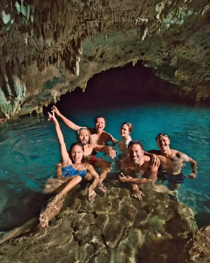 Visitors swimming in the tidal pool inside Rangko Cave, Labuan Bajo